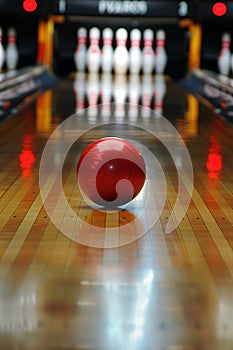 Bowling ball impact: striking pins on alley lane with forceful smash photo