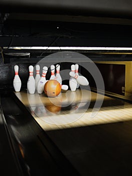 Bowling ball striking pins