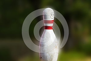 Bowling cone with white and red stripes photo