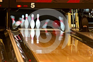 Bowling pins falling from ball