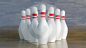 Bowling pins, white with red stripes aligned to get hit by a bowling ball photo