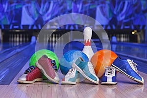 Bowling shoes, bowling pins and ball