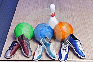 Bowling shoes and ball for playing the bowling game on track for a bowling game closeup