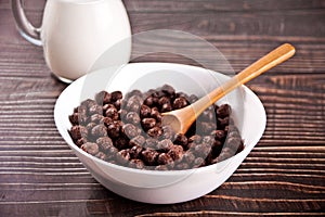 bowls with chocolate sweet corn balls. Delicious and healthy breakfast cereal.