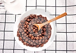 bowls with chocolate sweet corn balls. Delicious and healthy breakfast cereal.