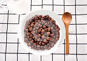 bowls with chocolate sweet corn balls. Delicious and healthy breakfast cereal.