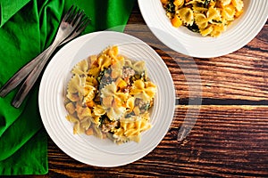 Bowls of Creamy Roasted Butternut Squash Pasta with Sausage and Spinach