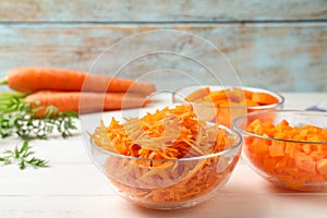 Bowls of differently cut carrots
