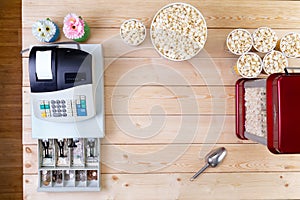 Bowls of fresh popcorn alongside a till