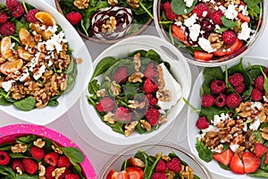 Bowls with fruit salad on table