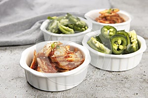 Bowls of kimchi and peppers