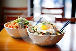 bowls of korean bibimbap ready for lunchtime customers