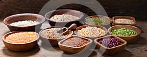 Bowls of legumes, lentils, chickpeas, beans, rice and cereals