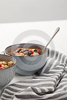 Bowls with muesli, dried berries and