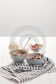 Bowls with muesli, dried berries and