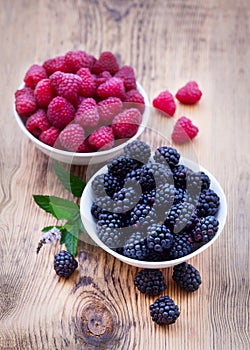 Bowls overflowing with summer berries like