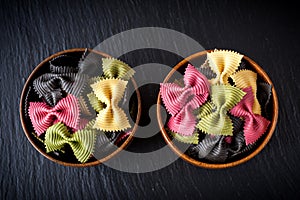 Bowls of pasta farfalle. Ingredients for Italian cooking.