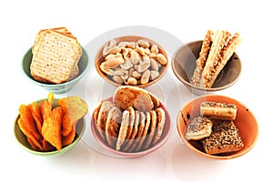 Bowls with salted snacks photo
