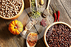 Bowls and spoons of various legumes