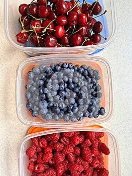 bowls with various fruits, summer fruits, raspberries, blueberries, cherries, fresh vitamins, natural fruits