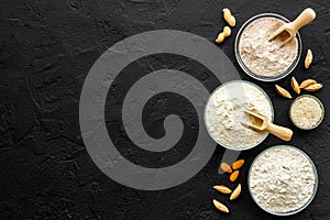 Bowls of various gluten free flour - almond peanut oat and rice buckwheat flour