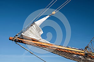 Bowsprit and gathered sail of a large sailing ship photo