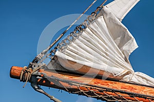 Bowsprit and gathered sail of a large sailing ship photo