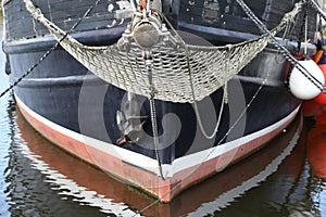 bowsprit with net of old sailboat photo