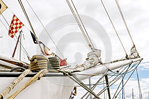 Bowsprit and rope coiled up of the sailing ship.