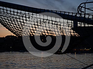 Bowsprit of a sailboat and sunset