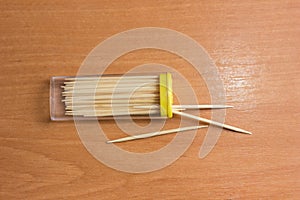 box of bamboo toothpicks on a table set