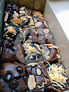 A box of chocolate chip and almond brownies.