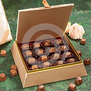 Box of chocolate on green background