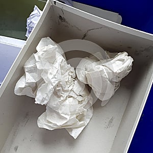 Box containing crumpled paper