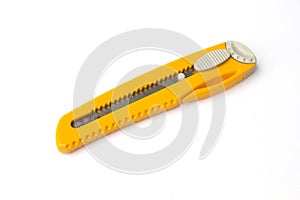 A box cutter which has rusty blade isolated on a white background