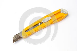 A box cutter which has rusty blade isolated on a white background