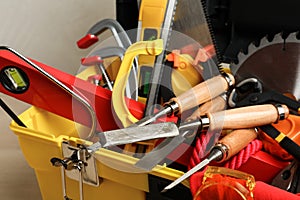 Box with different carpenter`s tools, closeup