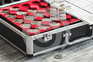 Box with different collector`s coins