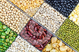 Box of different whole grains beans and legumes seeds lentils and nuts colorful snack texture background - Collage various beans