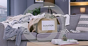 Box, donation and clothes for community service or social responsibility, non profit or charity. Fashion, package and