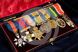 Box with English Vintage WWI medals on black photo