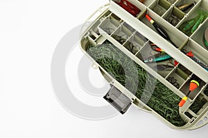 Box with fishing tackle on white background