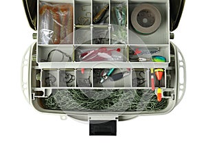 Box with fishing tackle on white background