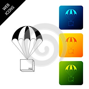 Box flying on parachute icon isolated. Parcel with parachute for shipping. Delivery service, air shipping concept, bonus photo