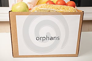 A box with food products for orphans in orphanages photo