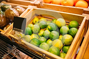 Box with fruits on stand in food store, nobody