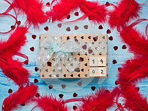 Box with a gift, tied with a ribbon, note with sweet words