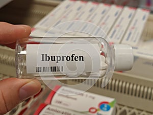 Box of ibuprofen tablets placed on a table, over-the-counter anti-inflammatory