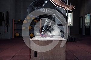 Box jump workout at cross fit gym closeup photo