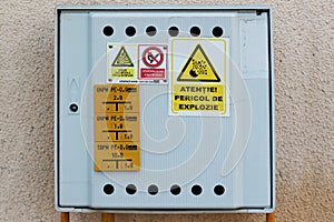 Box for natural gas meter, with warning messages on it photo